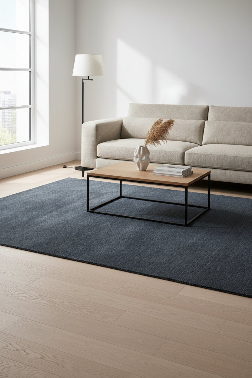A dark navy blue textured area rug shown from a top-down perspective against a white background.