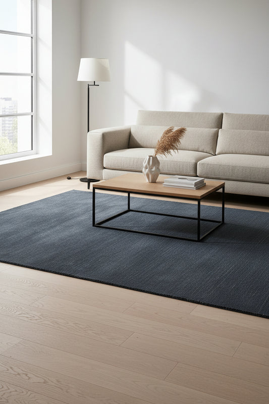 A dark navy blue textured area rug shown from a top-down perspective against a white background.