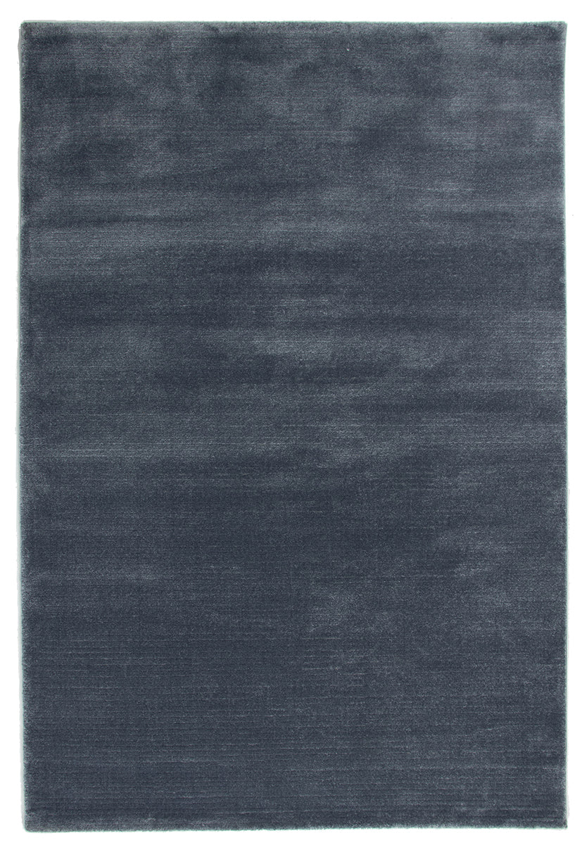 A rectangular area rug in a dark slate blue-gray color, shown from a top-down view against a white background.