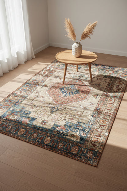 A traditional oriental-style area rug with a distressed vintage pattern, featuring a central medallion in red and blue on a beige field, surrounded by a detailed multi-colored border.