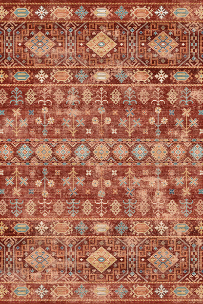A flat-lay view of a vintage-style area rug featuring a distressed tribal pattern in rust red, terracotta, beige, and light blue.
