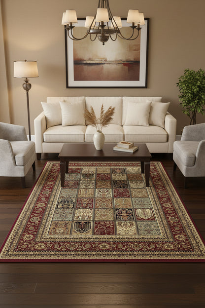 A rectangular area rug with an intricate patchwork design featuring multiple medallion panels in red, beige, brown, and black, surrounded by ornate borders.