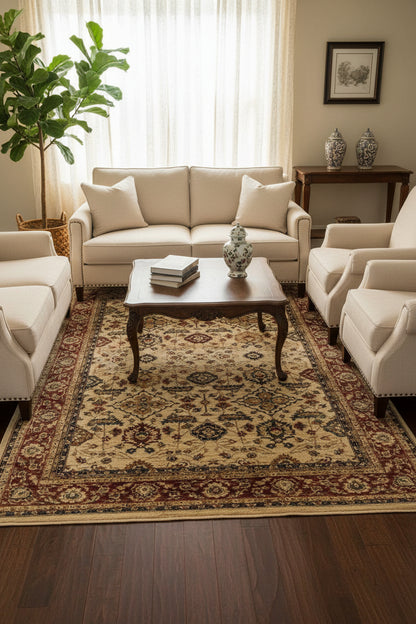 A traditional oriental-style area rug with an intricate floral and geometric pattern, featuring a beige center field, a dark red inner border, and a wide outer border in brown, beige, and red tones.