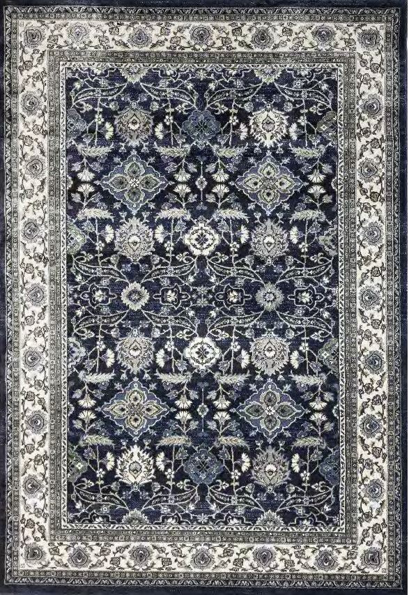 A traditional oriental-style area rug with an intricate floral and geometric pattern in navy blue, cream, and gray, shown flat from a top-down perspective.