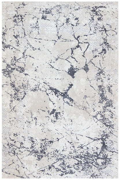 A square area rug with an abstract distressed pattern in cream, beige, and charcoal gray.