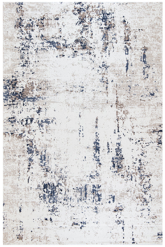 An abstract distressed area rug with a textured, vintage pattern in off-white, beige, and navy blue.